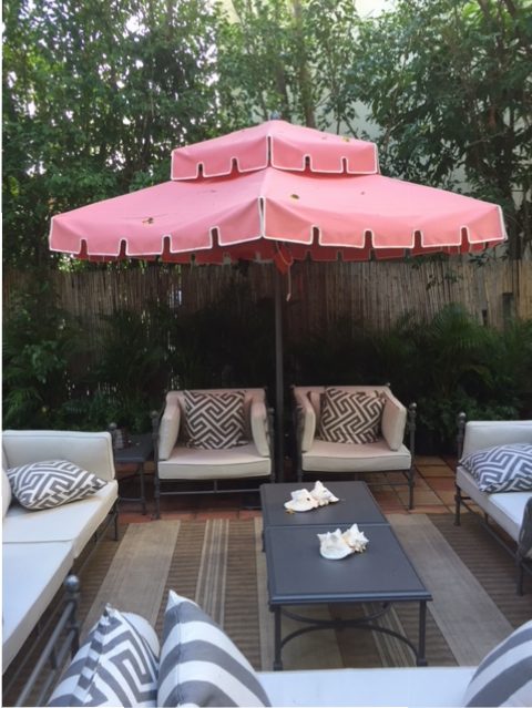 Palm Beach pink umbrellas by Santa Barbara Designs in both outdoor terraces.