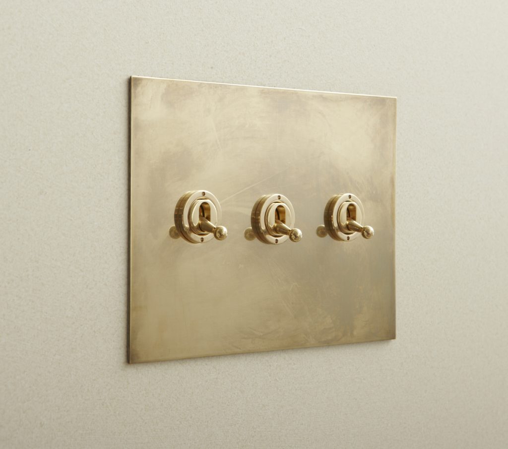 My aesthetically-minded client specified these unlacquered brass toggle switches from Forbes and Lomax. (Photo: Forbes and Lomax)