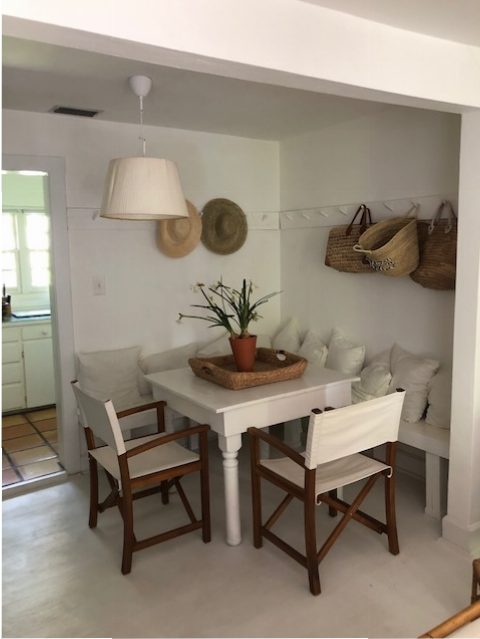 The Lacambra Spanish heritage is evident in the breakfast nook with the stark whiteness and woven straw baskets.