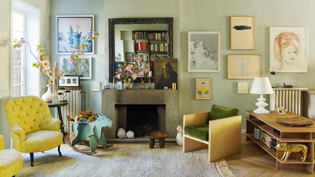 Two tufted arm chairs in Miranda Brooks' home are upholstered in a springtime yellow. (Photo: Annie Schlecter)