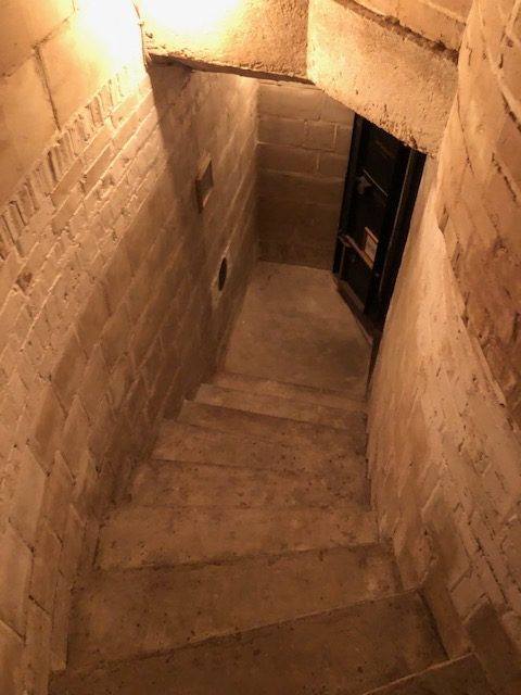 Secret stairs led to a basement hiding the evening beverages, Howey Mansion.