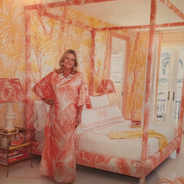 Meg Braff wearing a caftan matching the custom bed in her Kips Bay Show House bedroom.