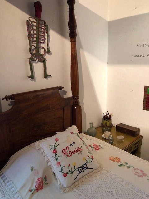 One of Frida's two beds. Framed butterflies are viewed when laying down to sleep.