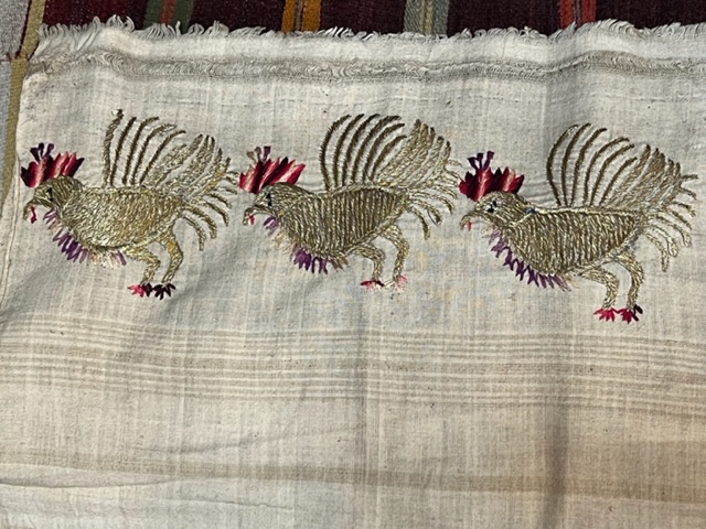 It is unthinkable to use these beautifully embroidered towels to dry one's hands, yet that was the use for these linens. This newer piece with metallic roosters tempted me.